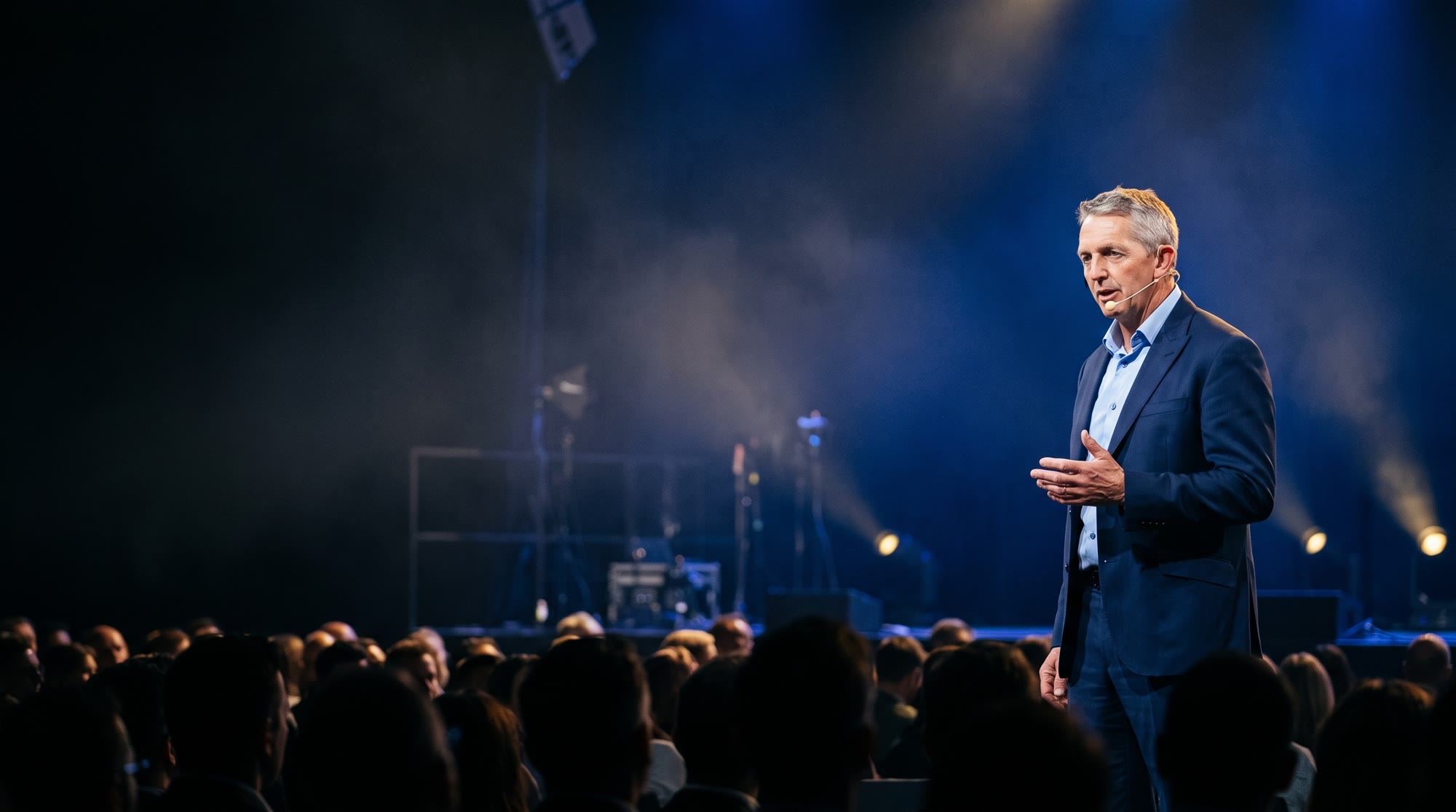Nige Thomas speaking on a conference stage